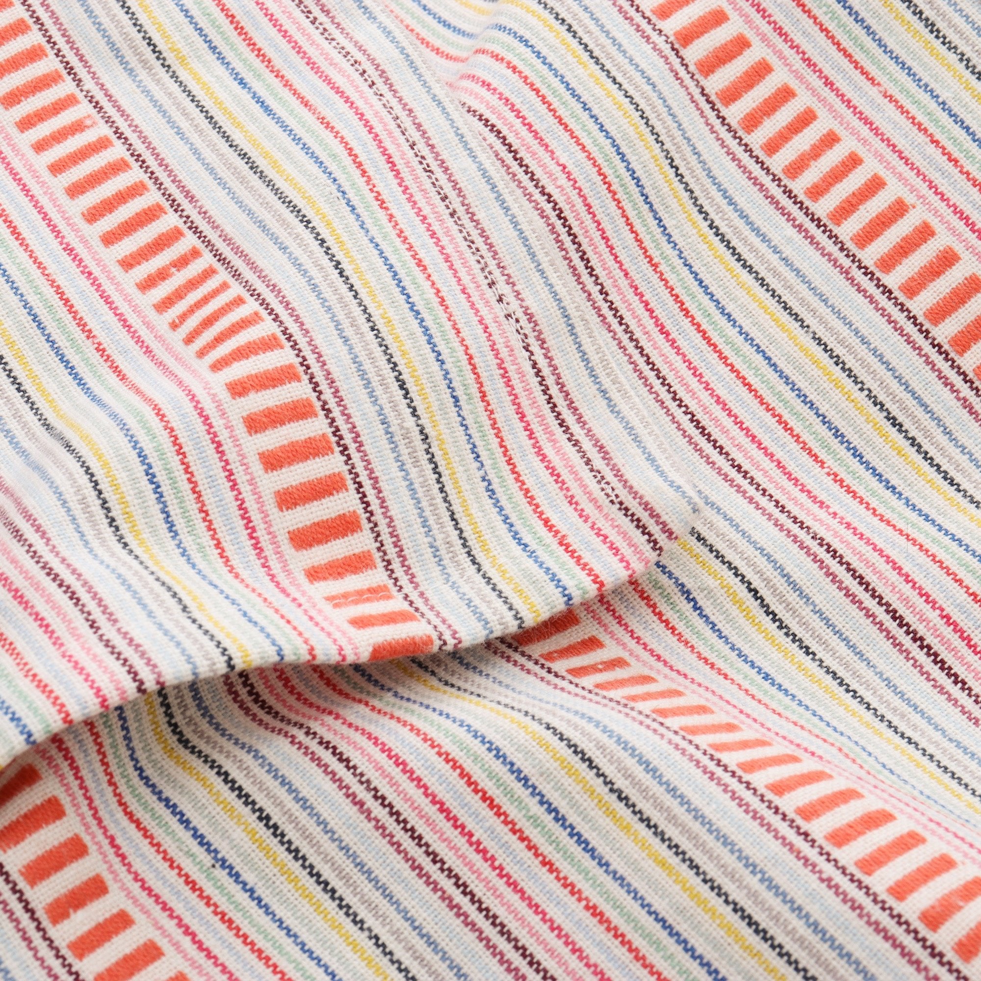 Contemporary striped tablecloth with subtle colorful detailing for modern dining decor