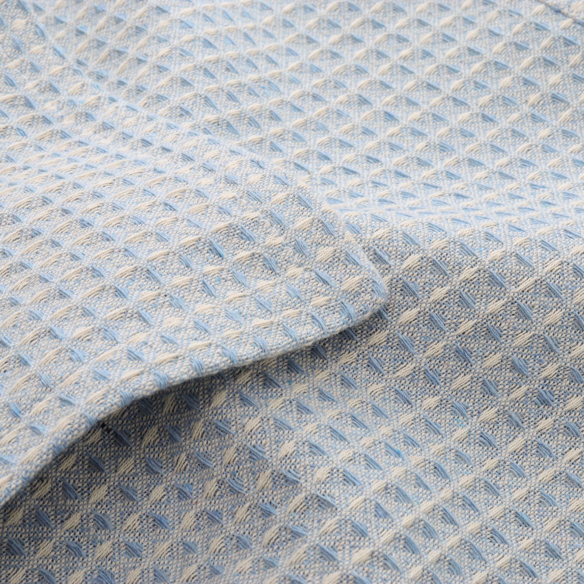 Modern powder blue waffle tablecloth styled in a luxury dining space