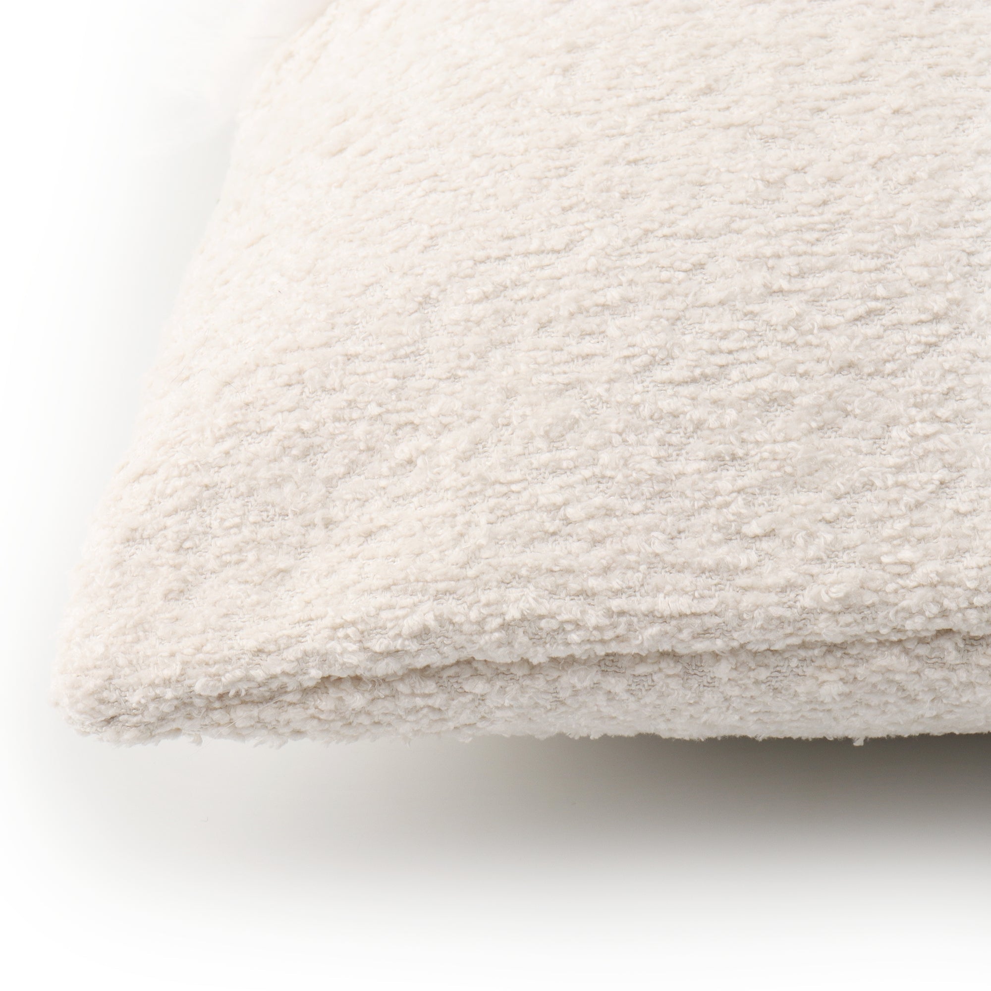 Modern white decorative cushion cover with elegant boucle detailing