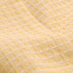 Butter yellow waffle texture dining tablecloth styled for contemporary home decor