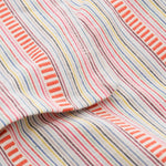 Contemporary striped tablecloth with subtle colorful detailing for modern dining decor
