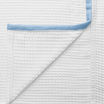 Luxury dusky blue bamboo bath towel with elegant waffle texture detailing