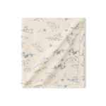 Elegant Flora Bloom tablecloth with soft floral patterns and premium textured fabric