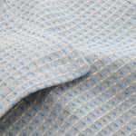 Modern powder blue waffle tablecloth styled in a luxury dining space